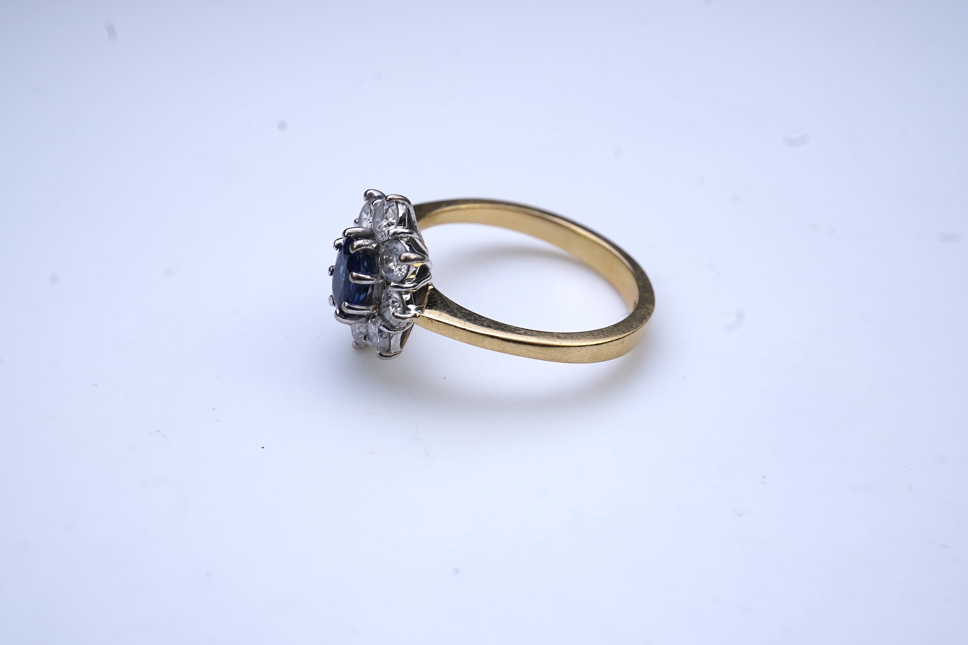 A sapphire and diamond cluster ring